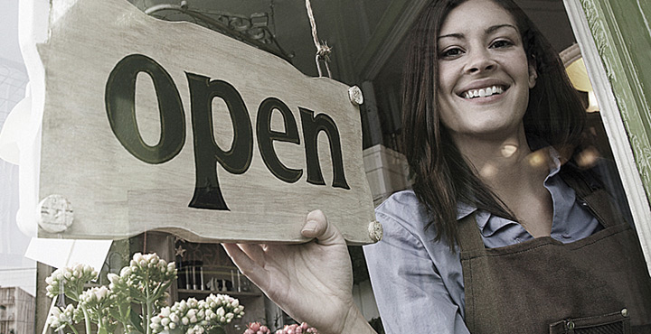Business Owner Holding Open Sign