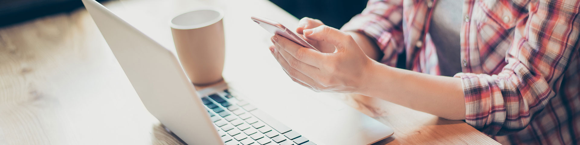 Woman on Cell Phone and Laptop