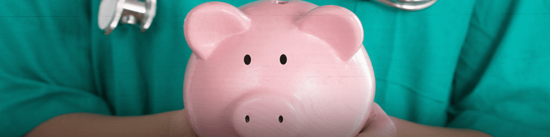 Doctor Holding a Piggy Bank
